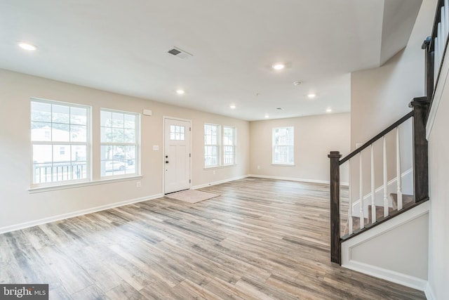 foyer featuring light hardwood / wood-style floors and a wealth of natural light