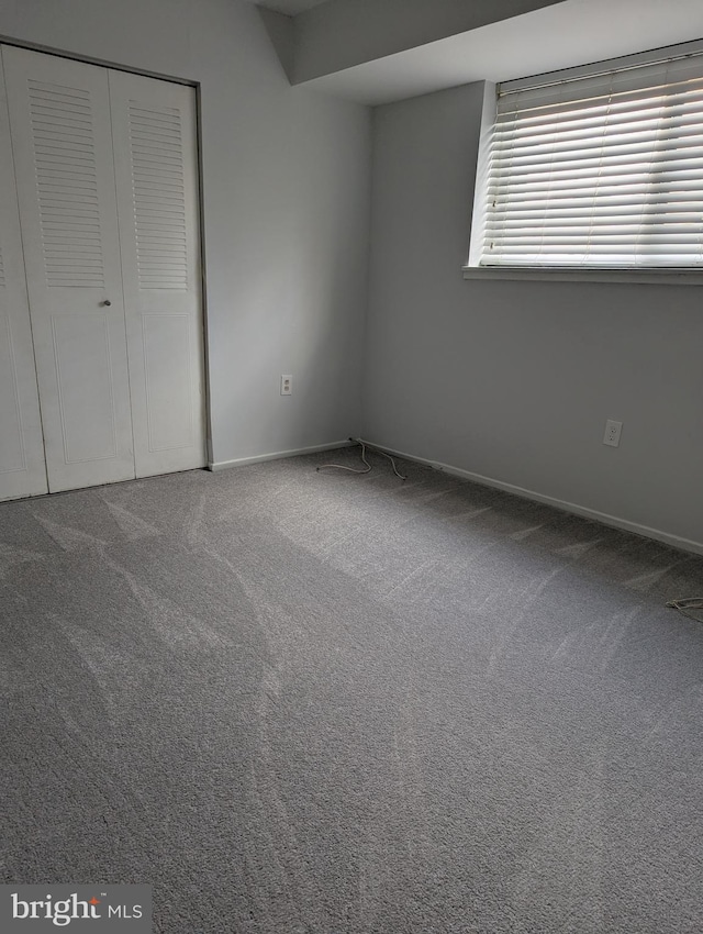 unfurnished bedroom featuring carpet floors