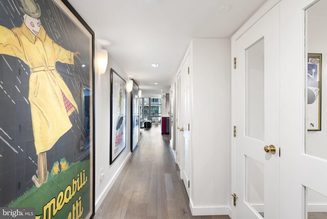 hallway featuring hardwood / wood-style flooring