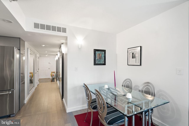 dining room featuring wood-type flooring