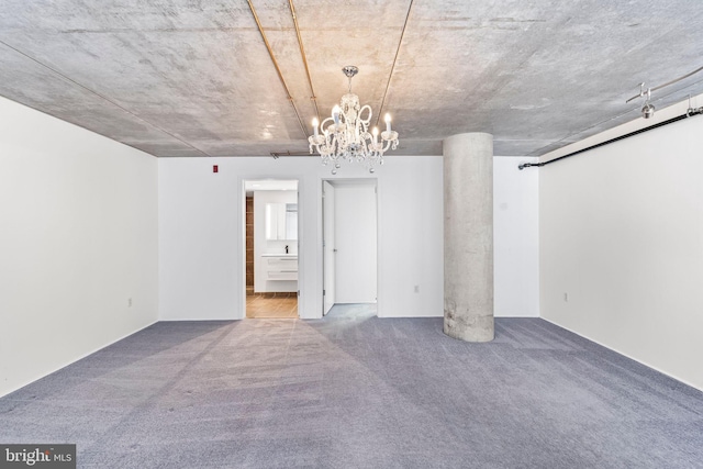 interior space featuring a notable chandelier and carpet flooring