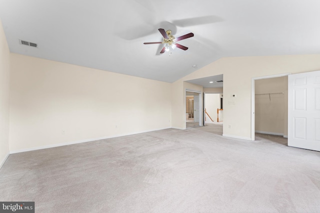 interior space featuring ceiling fan, a closet, and light carpet