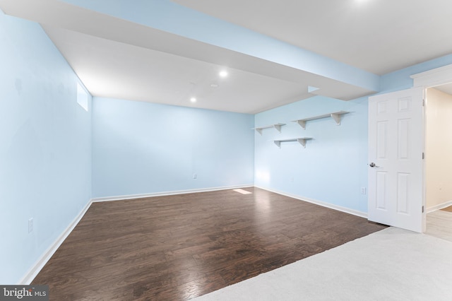 basement with hardwood / wood-style floors