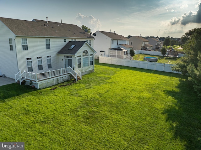 view of yard with a wooden deck