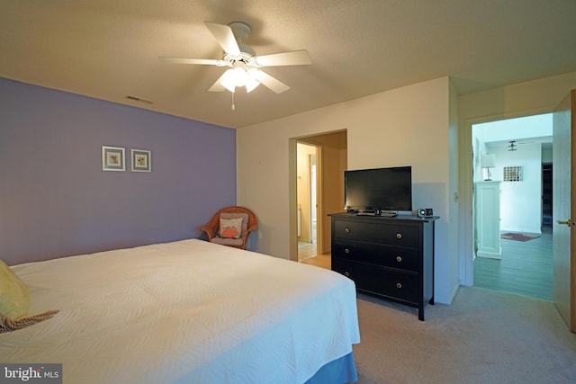 carpeted bedroom with ceiling fan