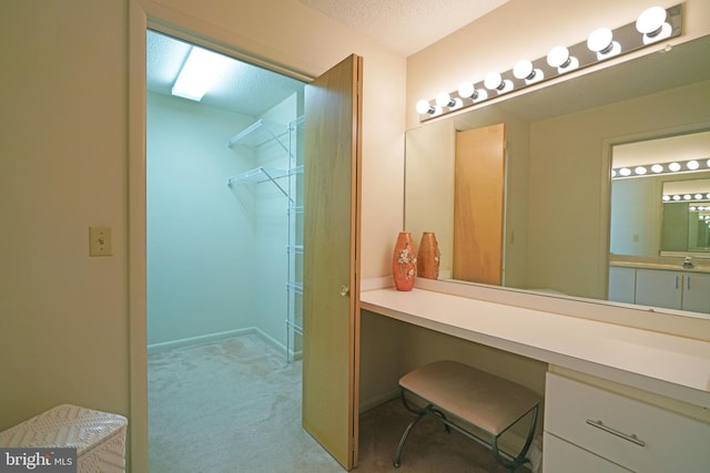 bathroom with vanity and a textured ceiling