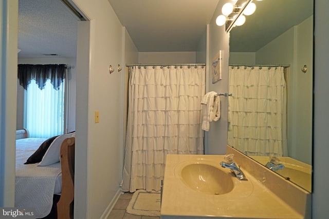 bathroom with vanity and tile patterned floors