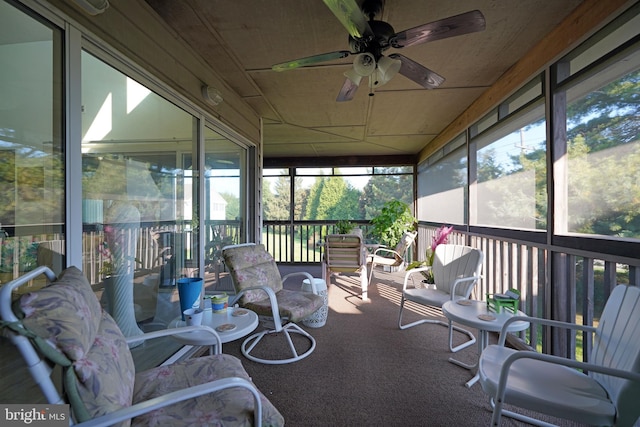 sunroom / solarium with ceiling fan