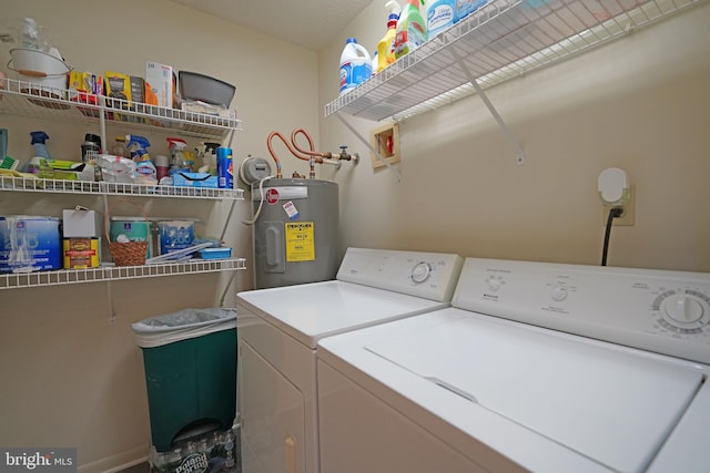 washroom featuring independent washer and dryer and water heater