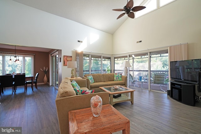 living room featuring ceiling fan, high vaulted ceiling, and dark hardwood / wood-style flooring