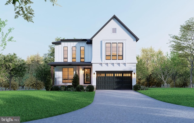 modern farmhouse featuring a garage and a front lawn