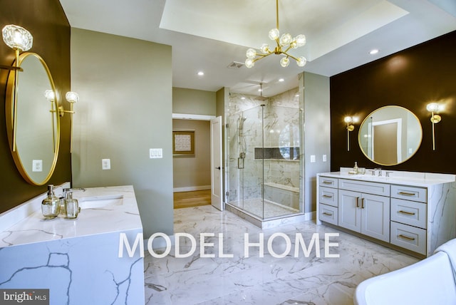 bathroom with a raised ceiling, vanity, and a shower with door