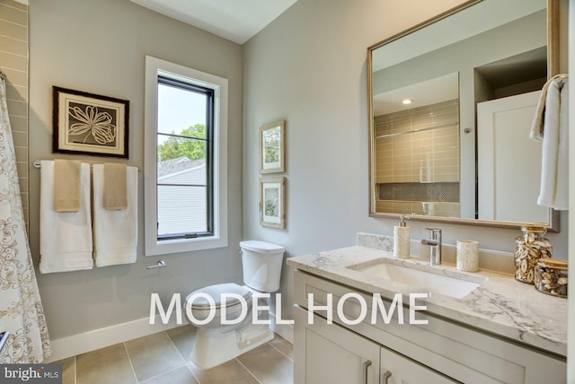 bathroom with vanity, tile patterned flooring, toilet, and a shower with shower curtain