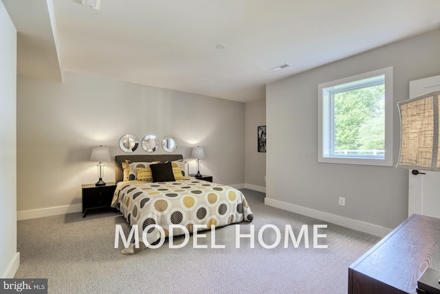 bedroom with light colored carpet