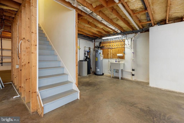 basement featuring water heater and sink