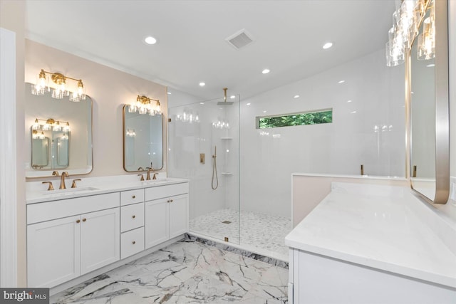 bathroom with tiled shower and vanity