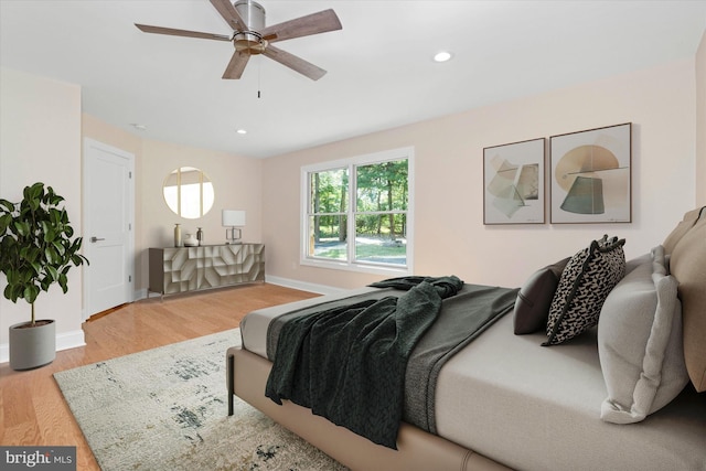 bedroom featuring wood-type flooring and ceiling fan