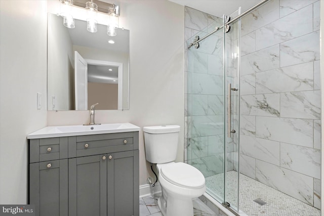 bathroom featuring walk in shower, vanity, and toilet