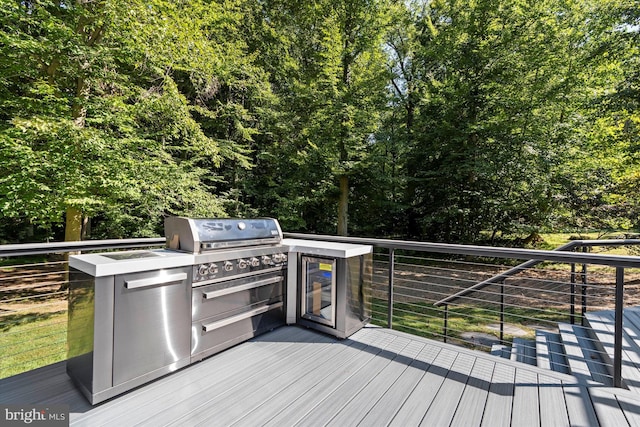 wooden deck with exterior kitchen