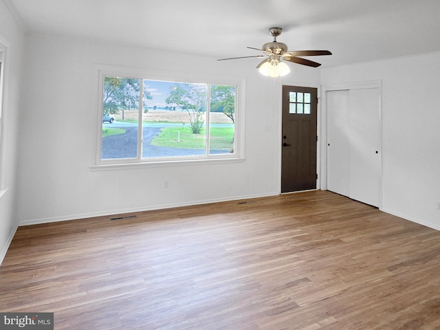 entryway with ceiling fan and light hardwood / wood-style flooring