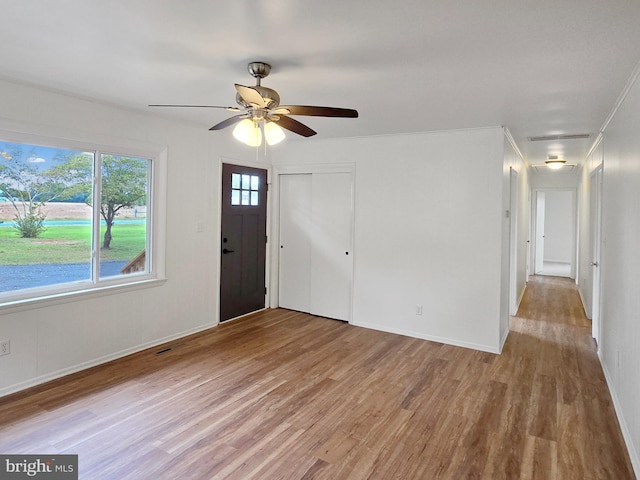 entryway with ceiling fan and light wood-type flooring