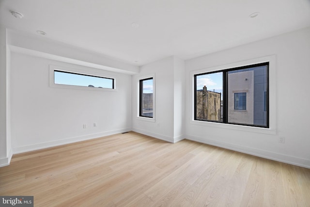 706 Latona St Unit F, Philadelphia, PA 19147 - unfurnished room featuring light wood finished floors, baseboards, and a smoke detector