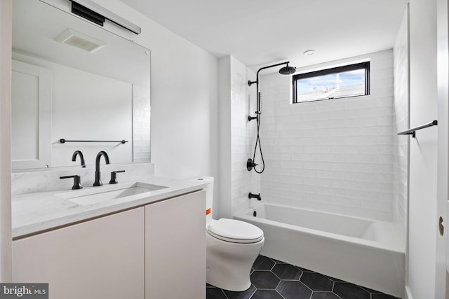 706 Latona St Unit F, Philadelphia, PA 19147 - bathroom featuring toilet, vanity, tile patterned flooring, and washtub / shower combination
