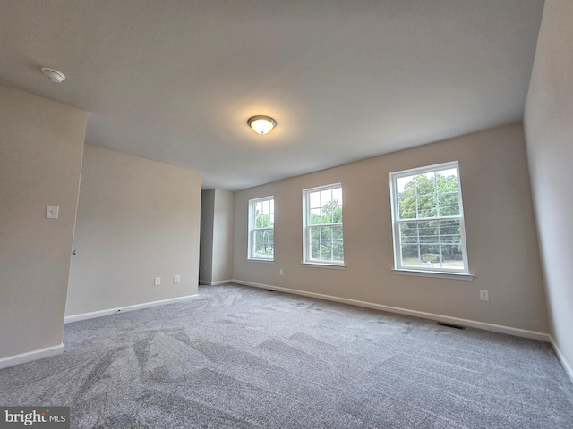 unfurnished room with carpet