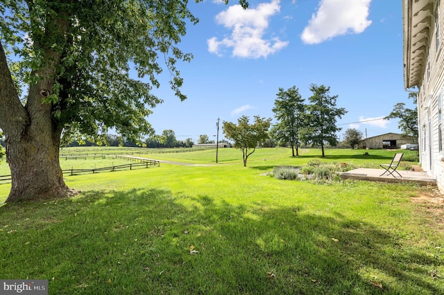 view of yard with a rural view