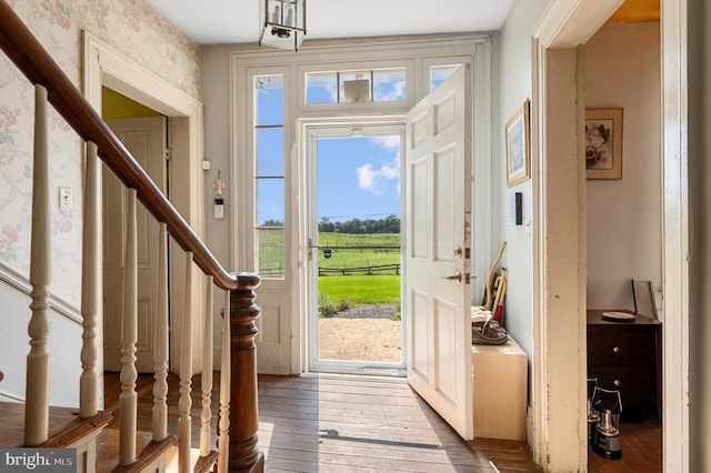 foyer entrance with hardwood / wood-style flooring