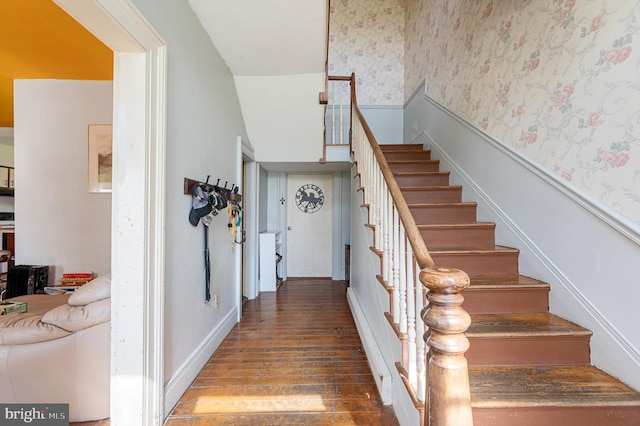 staircase with hardwood / wood-style floors