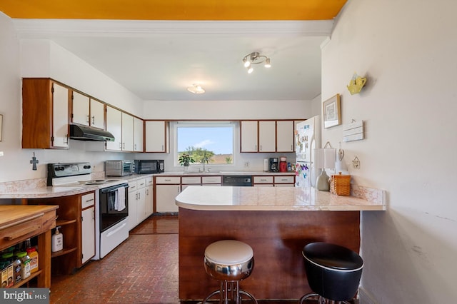 kitchen with black appliances, white cabinetry, kitchen peninsula, and a breakfast bar