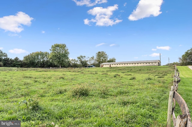 view of yard with a rural view