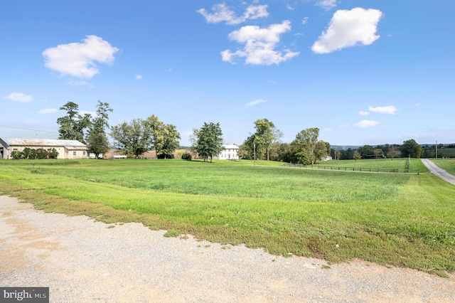 view of yard with a rural view