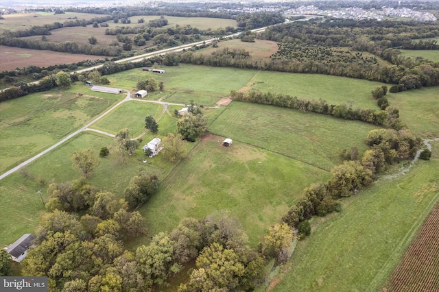 birds eye view of property featuring a rural view