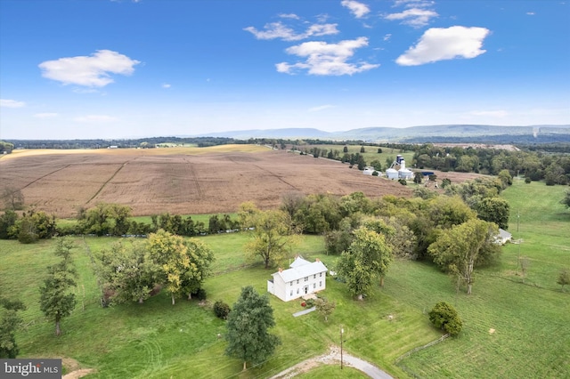 birds eye view of property featuring a mountain view and a rural view