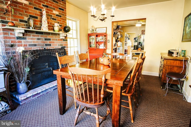 carpeted dining room featuring a fireplace