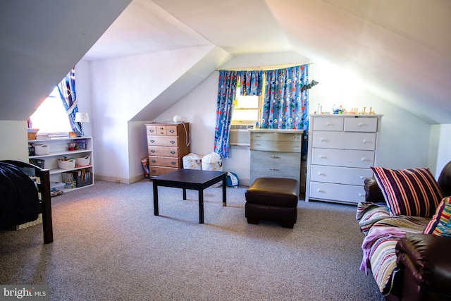carpeted bedroom with vaulted ceiling