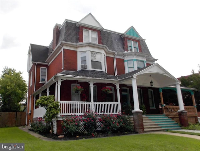 view of front of home featuring a porch and a front yard