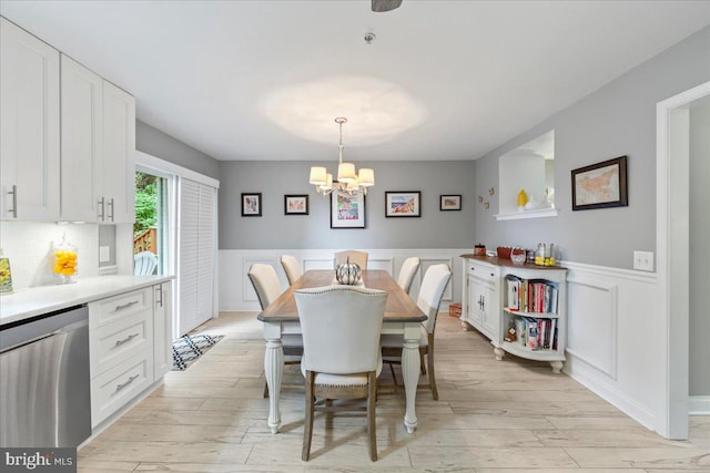 dining space featuring a notable chandelier and light hardwood / wood-style flooring