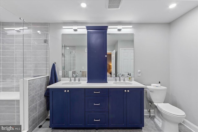 bathroom featuring walk in shower, vanity, and toilet