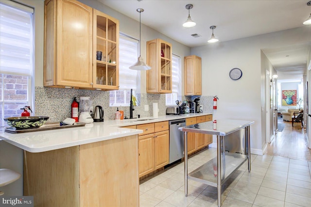 kitchen with a wealth of natural light and light brown cabinets