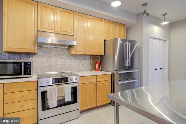 kitchen with appliances with stainless steel finishes, light tile patterned flooring, tasteful backsplash, light brown cabinetry, and decorative light fixtures