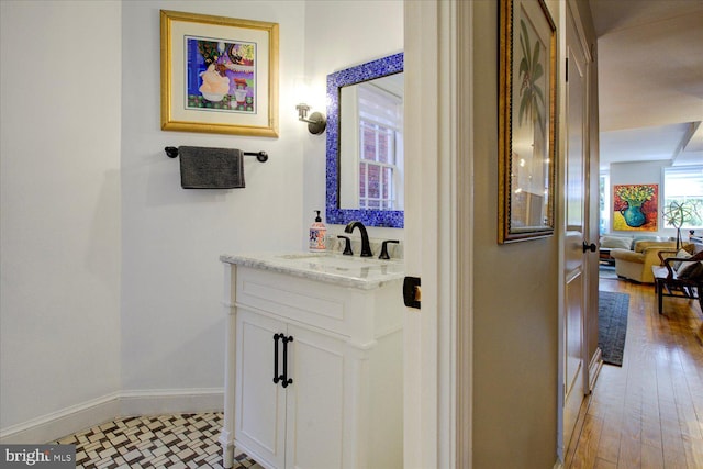 interior space with light hardwood / wood-style floors and sink