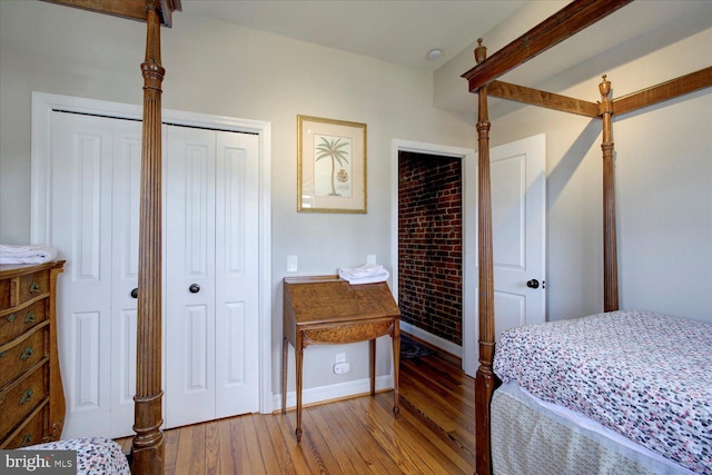 bedroom featuring hardwood / wood-style flooring and a closet