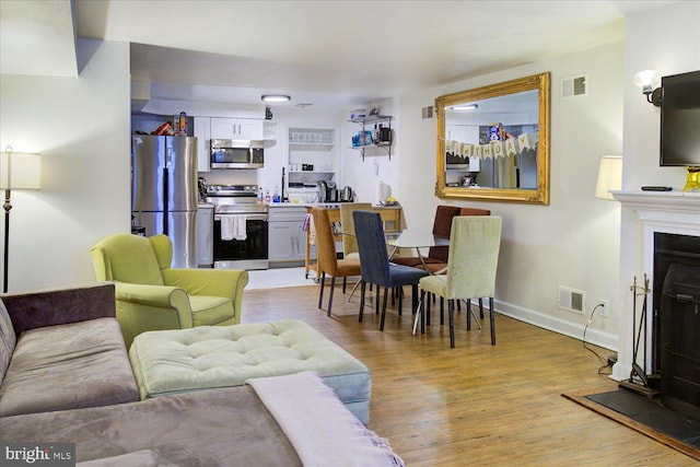 living room featuring light hardwood / wood-style flooring