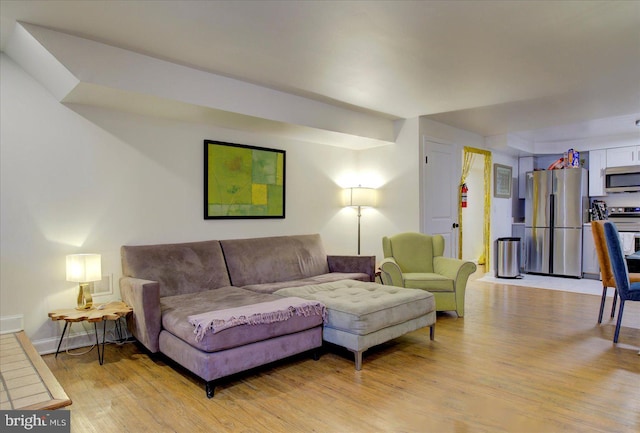 living room with light hardwood / wood-style flooring