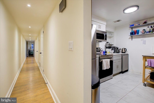 hall featuring light hardwood / wood-style floors