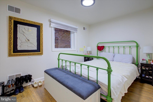 bedroom featuring wood-type flooring