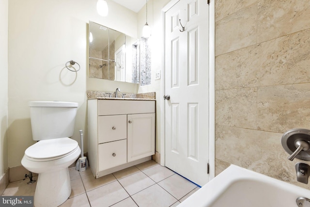 bathroom with vanity, toilet, and tile patterned floors